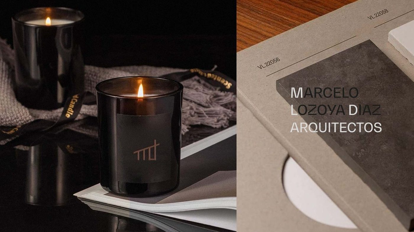 Black candle jar and grey notebook embossed with the Marcelo Lozoya Diaz Arquitectos wordmark