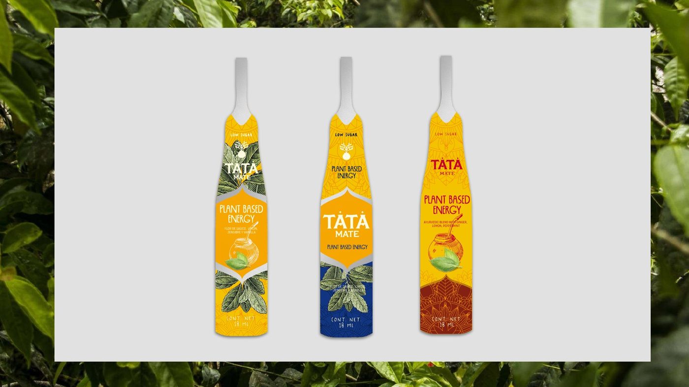Three TATA Mate glass bottles with yellow, blue and orange labels